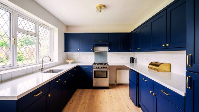 After kitchen respray London – navy blue matt cabinets with brushed brass handles