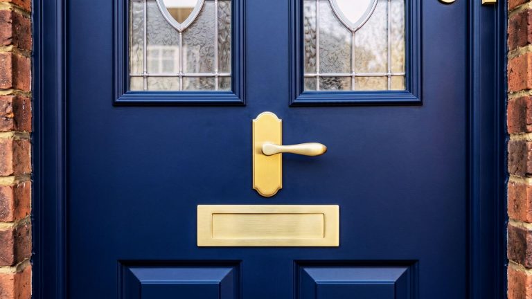 After UPVC door spray painting London – flawless navy blue finish with brushed brass handles