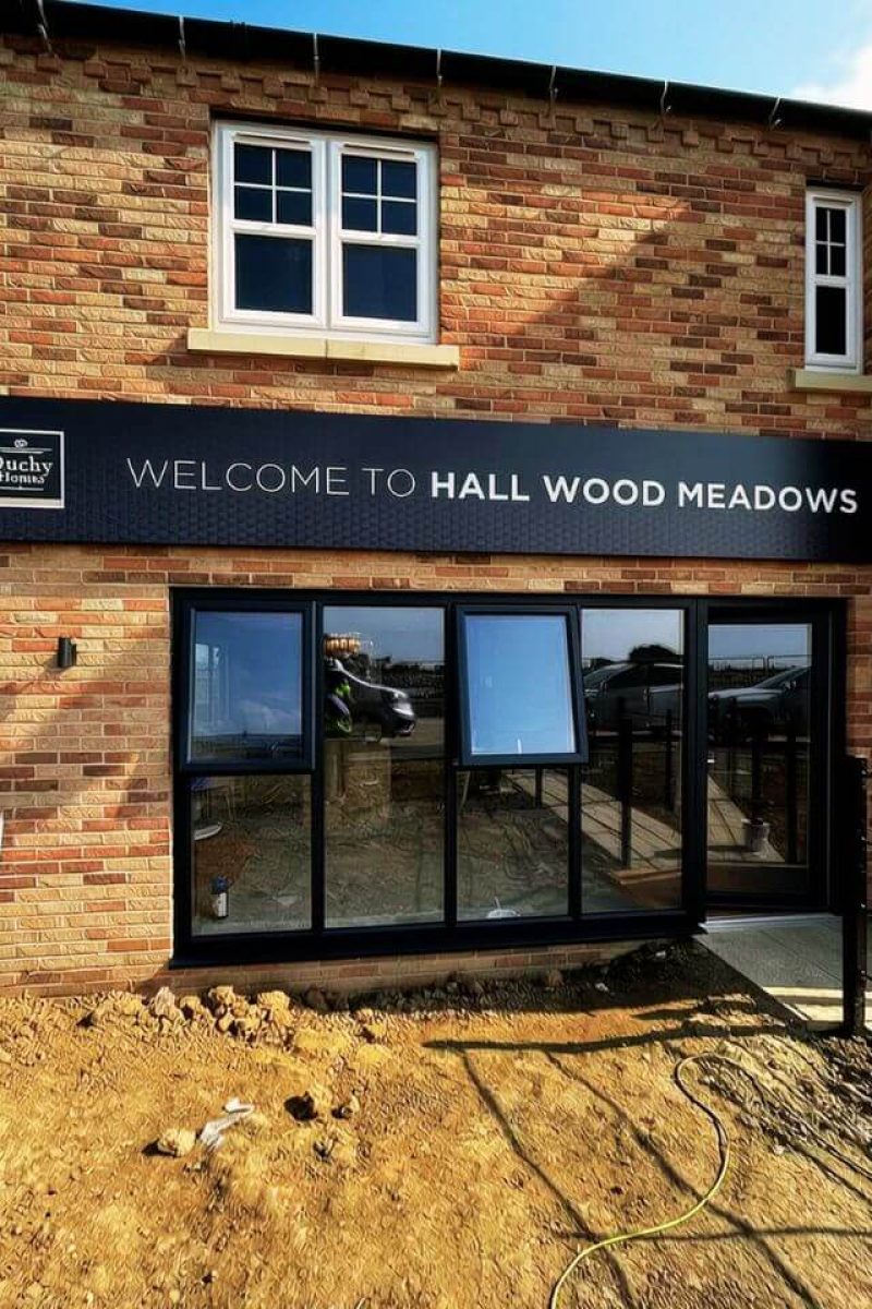 Professional commercial spray painting London – boutique shop front sprayed in heritage black finish