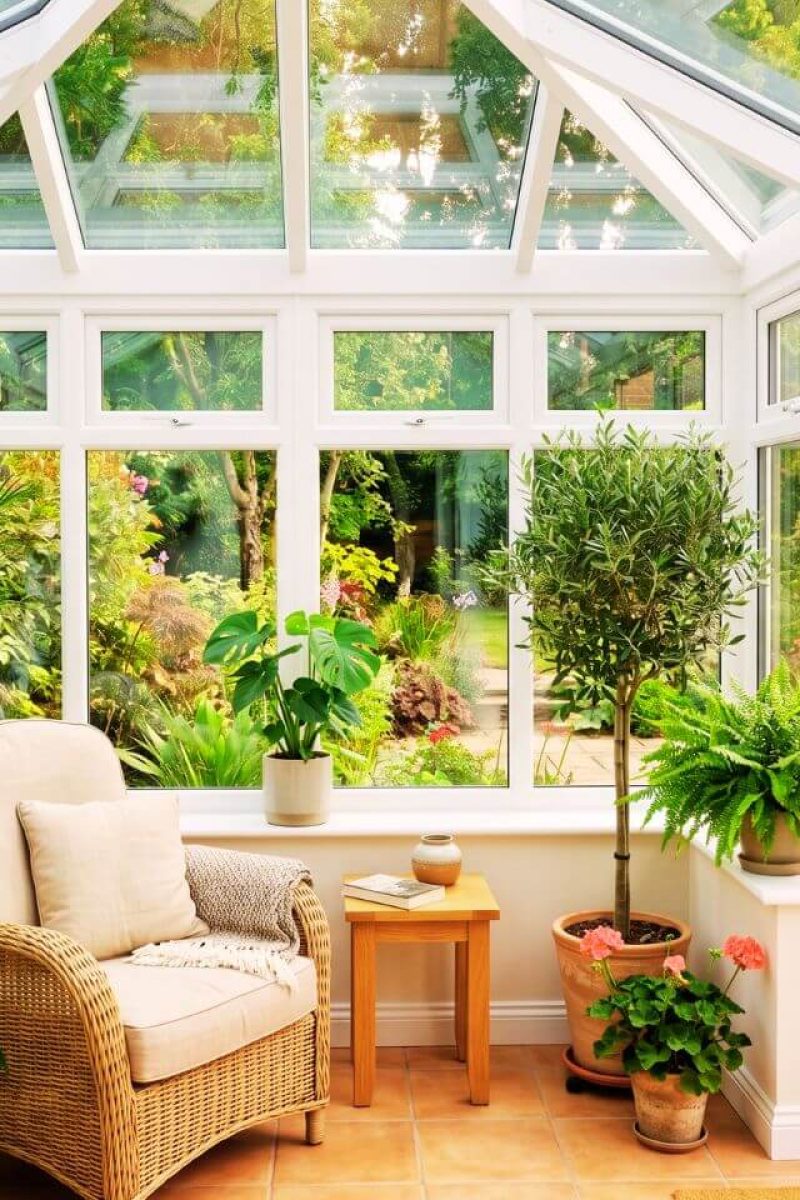 Bright conservatory interior London – UPVC frames freshly sprayed in pure white satin finish