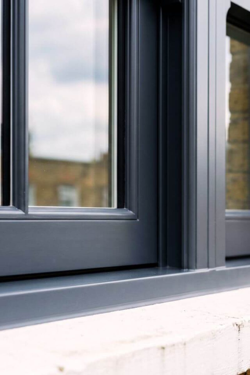 UPVC sash window spray painting London – flawless anthracite grey satin finish close-up