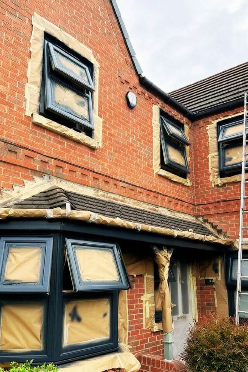 UPVC sash window spray painting London – flawless anthracite grey satin finish close-up